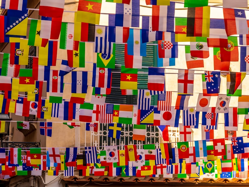 A wall of colourful world flags